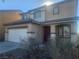 Two-story house with attached garage and red front door at 3513 Kendall Point Ave, North Las Vegas, NV 89081