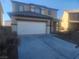 Two-story house with attached garage and desert landscaping at 3513 Kendall Point Ave, North Las Vegas, NV 89081