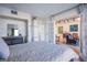 Bedroom with a queen bed and view of living room at 3930 University Center Dr # 307, Las Vegas, NV 89119