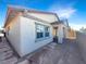 Home's backyard features a covered patio and flagstone walkways at 480 Sterling Falls Ave, Henderson, NV 89011