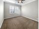 Large bedroom with plush carpeting and window with plantation shutters at 480 Sterling Falls Ave, Henderson, NV 89011