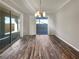 Bright dining room with hardwood floors and sliding glass doors to backyard at 480 Sterling Falls Ave, Henderson, NV 89011