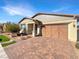 Two-car garage and nicely landscaped front yard at 480 Sterling Falls Ave, Henderson, NV 89011