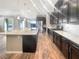 Open concept kitchen with large island, stainless steel appliances, and hardwood floors at 480 Sterling Falls Ave, Henderson, NV 89011