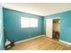 Teal bedroom with wood flooring and a closet at 523 Fir St, Boulder City, NV 89005