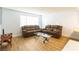 Living room with two brown leather couches and coffee table at 523 Fir St, Boulder City, NV 89005