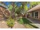 Beautiful backyard with a small grass area and a covered patio at 561 Tecate Valley St, Las Vegas, NV 89138