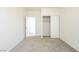 Empty bedroom with closet, en-suite bathroom, neutral carpet and white walls at 561 Tecate Valley St, Las Vegas, NV 89138