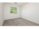 Bright bedroom with new carpet and view from the front window at 561 Tecate Valley St, Las Vegas, NV 89138