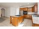 Spacious kitchen with stainless steel appliances, island cooktop, and tile floors at 561 Tecate Valley St, Las Vegas, NV 89138