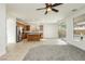 Open concept kitchen with stainless steel appliances, kitchen island, and sliding glass doors to the backyard at 561 Tecate Valley St, Las Vegas, NV 89138