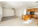 Open concept kitchen with center island, stainless steel appliances, and tile flooring at 561 Tecate Valley St, Las Vegas, NV 89138