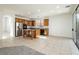 Spacious kitchen with stainless steel appliances, island cooktop, and tile floors at 561 Tecate Valley St, Las Vegas, NV 89138