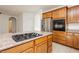 View of the kitchen island with stainless steel appliances at 561 Tecate Valley St, Las Vegas, NV 89138