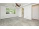 Large main bedroom with plush carpeting, tray ceiling, and doorway to the main bathroom at 561 Tecate Valley St, Las Vegas, NV 89138