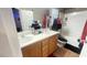 Bathroom with double vanity and a tub at 59 Dreamy Hill Ave, North Las Vegas, NV 89031