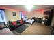 Spacious bedroom with a couch and a large TV at 59 Dreamy Hill Ave, North Las Vegas, NV 89031