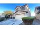 Two-story house with stone accents, attached garage, and landscaping at 59 Dreamy Hill Ave, North Las Vegas, NV 89031