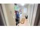 Bright laundry room with washer, dryer, and shelving at 59 Dreamy Hill Ave, North Las Vegas, NV 89031