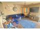 Living room with sectional sofa, game console, and large TV at 59 Dreamy Hill Ave, North Las Vegas, NV 89031