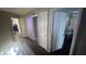 Upstairs hallway with doors to bedrooms and bathroom at 59 Dreamy Hill Ave, North Las Vegas, NV 89031
