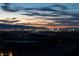 Night time aerial view with city lights and mountain backdrop at 705 Dragon Peak Dr, Henderson, NV 89012