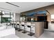 Contemporary bar with a large screen TV and comfortable seating at 705 Dragon Peak Dr, Henderson, NV 89012