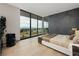 Modern bedroom with large window offering scenic views and ensuite bathroom at 705 Dragon Peak Dr, Henderson, NV 89012