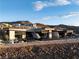 Modern home with sleek architecture, infinity pool, and stunning mountain views at 705 Dragon Peak Dr, Henderson, NV 89012