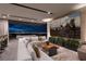 Spacious living room with city views, large sectional sofa, and modern decor at 705 Dragon Peak Dr, Henderson, NV 89012