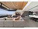 Open living area with fireplace, sectional sofa, and mountain views at 705 Dragon Peak Dr, Henderson, NV 89012