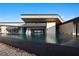Luxury infinity pool with a view of the home's interior at 705 Dragon Peak Dr, Henderson, NV 89012