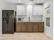 Basement kitchenette with modern appliances and cabinets at 7840 Thunder Echo St, Las Vegas, NV 89131