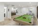 Basement featuring a pool table, bar sink, and additional seating area at 7840 Thunder Echo St, Las Vegas, NV 89131