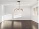 Spacious dining room featuring hardwood floors and chandelier at 7840 Thunder Echo St, Las Vegas, NV 89131