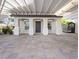 Home exterior with covered entryway and paved courtyard at 7840 Thunder Echo St, Las Vegas, NV 89131