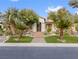 Single-story home with landscaped front yard and palm trees at 7840 Thunder Echo St, Las Vegas, NV 89131