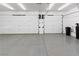 Clean and spacious garage with epoxy flooring and ample storage at 7840 Thunder Echo St, Las Vegas, NV 89131