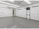 Bright and spacious garage with epoxy flooring and ample storage at 7840 Thunder Echo St, Las Vegas, NV 89131