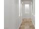 Long hallway with recessed lighting and tile flooring at 7840 Thunder Echo St, Las Vegas, NV 89131