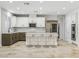 Spacious modern kitchen with stainless steel appliances, large island with seating, and neutral color palette at 7840 Thunder Echo St, Las Vegas, NV 89131