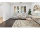 Bright office space with tufted chairs, wood floors, and a modern desk at 7840 Thunder Echo St, Las Vegas, NV 89131