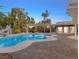 Relaxing pool area with a water slide and pergola at 7840 Thunder Echo St, Las Vegas, NV 89131