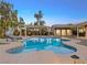 Inviting pool with a water slide, pergola, and spacious patio at 7840 Thunder Echo St, Las Vegas, NV 89131