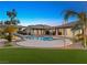 Inviting pool area with a water slide and artificial turf at 7840 Thunder Echo St, Las Vegas, NV 89131