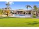 Inviting backyard oasis with a pool, slide, and covered patio at 7840 Thunder Echo St, Las Vegas, NV 89131