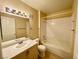 Bright bathroom featuring a tub/shower combination and single sink vanity at 8441 Blue Island Ave, Las Vegas, NV 89129