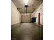 Attached single car garage with painted concrete floor at 8441 Blue Island Ave, Las Vegas, NV 89129