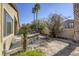 Landscaped backyard with built-in BBQ and patio at 869 Ashford Way, Henderson, NV 89015