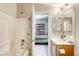 Bathroom with a tub, shower, and double vanity at 869 Ashford Way, Henderson, NV 89015